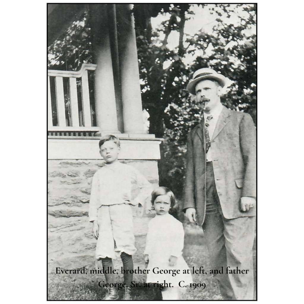 A man and two children standing in front of a house.